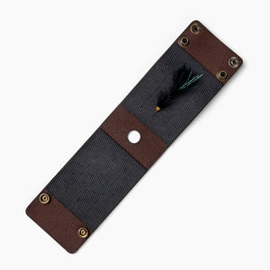 Leather fly wallet for fly fishing open natural rubber with wooly bugger